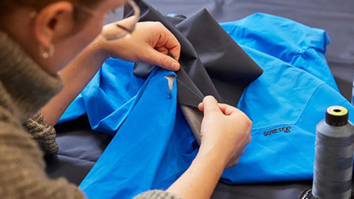 Staff assessing a repair on GORE-TEX Gear