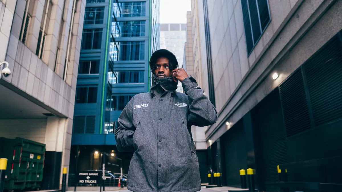 Man wearing a GORE-TEX/The North Face Jacket, in a city