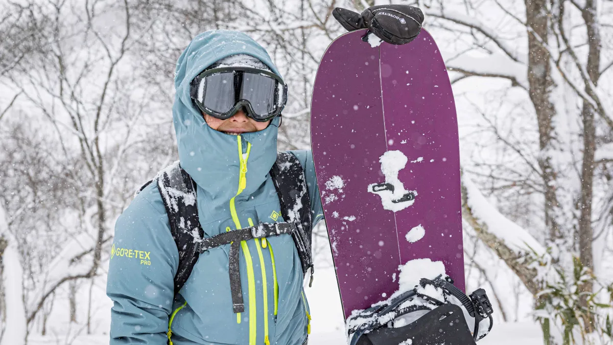 Mami Tezuka standing next to a snowboard