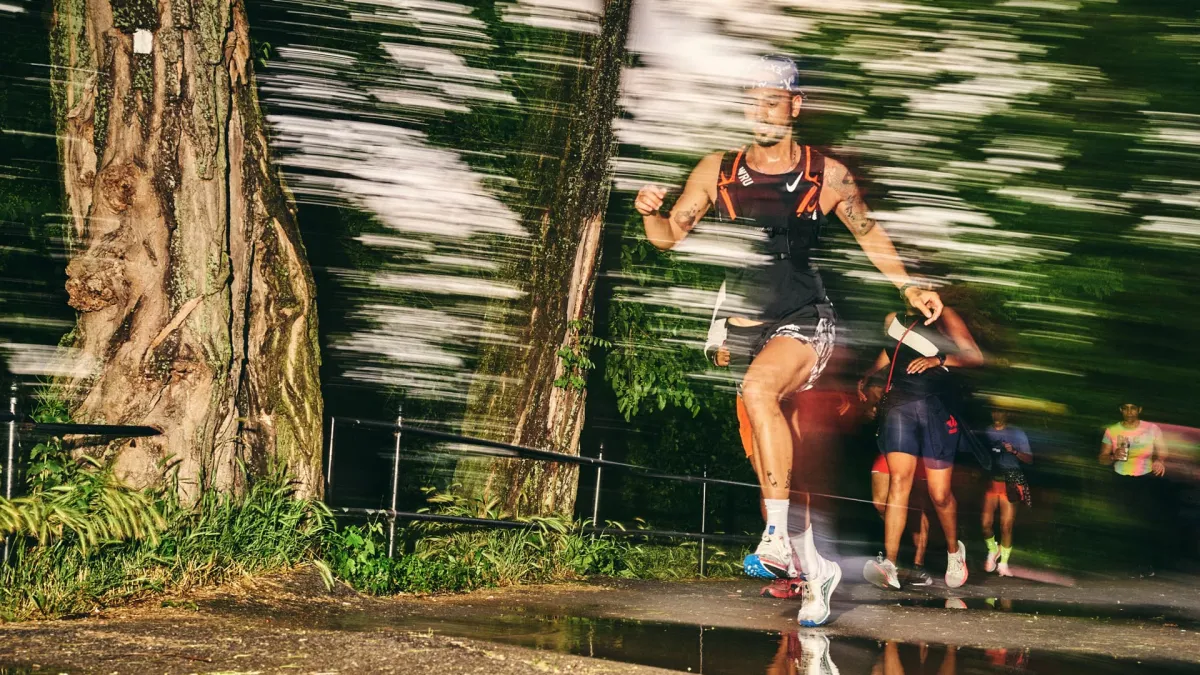 Man leading a group of trail runners, wearing GORE-TEX Footwear