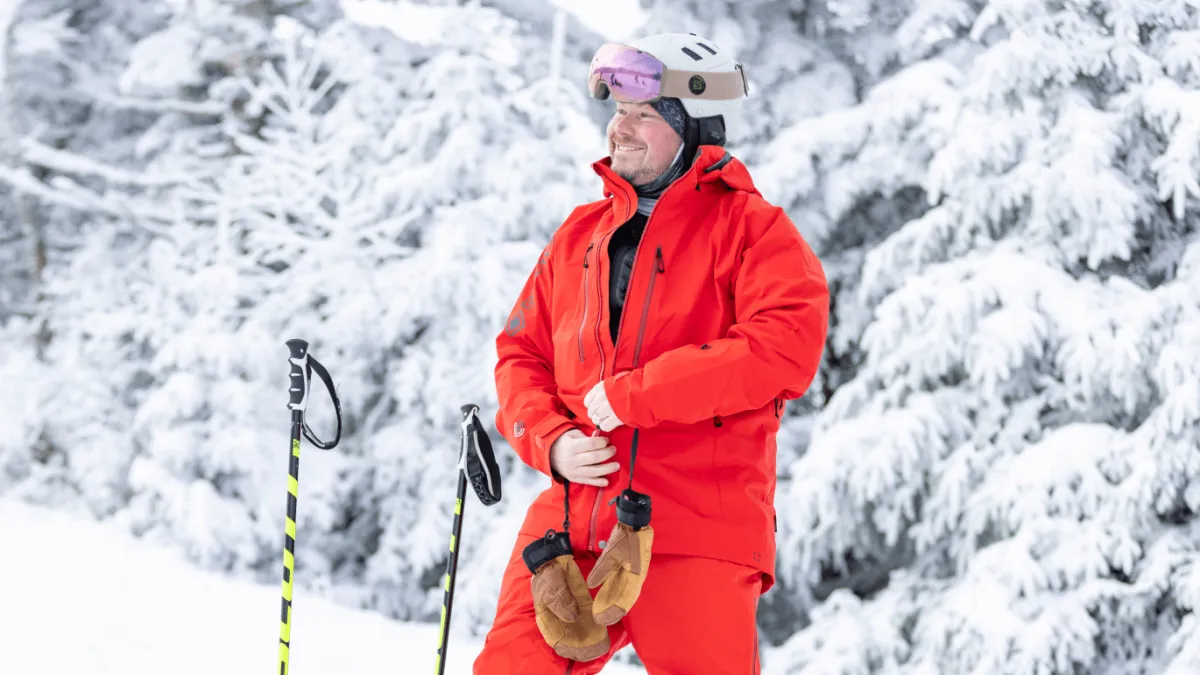Man standing in GORE-TEX rental ski clothes